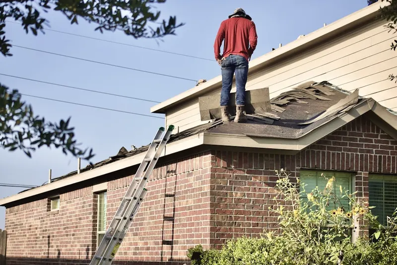 Professional roofer working on a residential roof in Riga